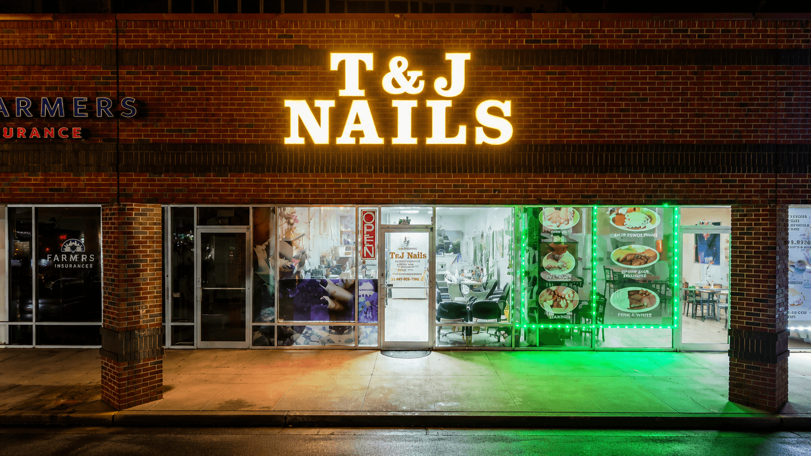 T&J Nails storefront in Old Towne Katy, TX at night